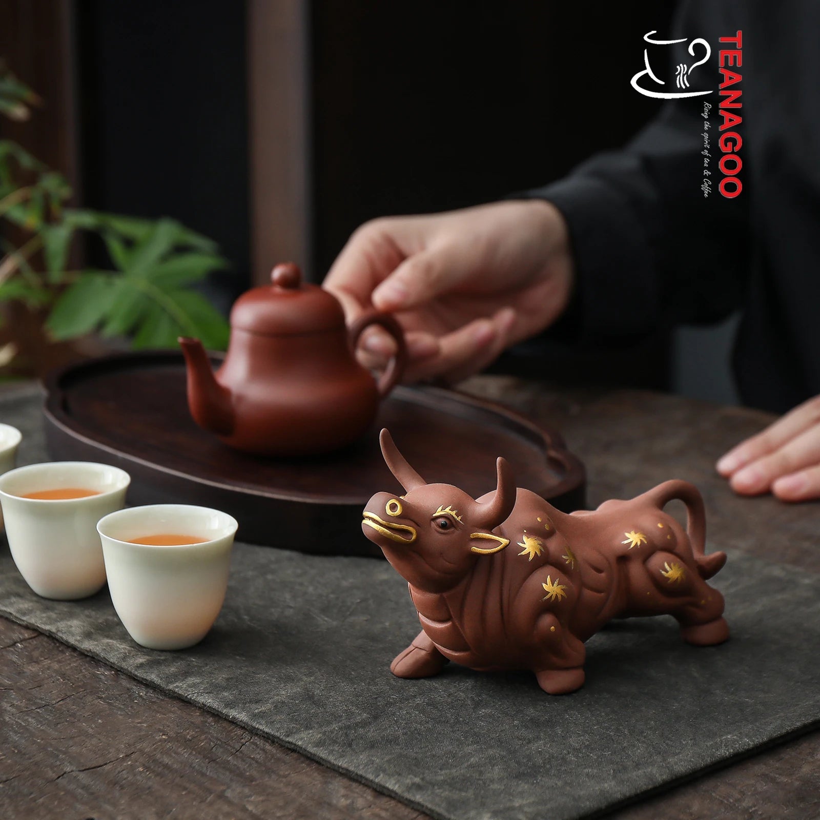 https://www.teanagoo.com/cdn/shop/products/Cute_Buffalo_Pottery_Tea_Toy_Chinese_Kungfu_Tea_Set_Pet_Tea_Tray_Tea_Pet_Handmade_Tea_Pet_04-02.jpg?v=1668492081&width=1946