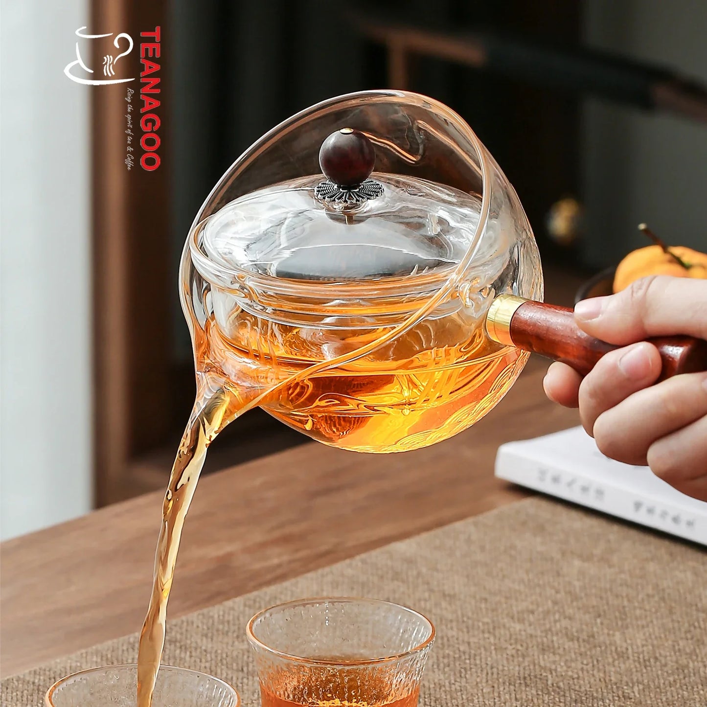 https://www.teanagoo.com/cdn/shop/products/Translucent_White_Teapot_with_Infuser_and_Rosewood_Handle_275ml_Safe_on_Stove_for_Blooming_and_Loose_Leaf_Tea_Maker_-2.webp?v=1676864808&width=1445