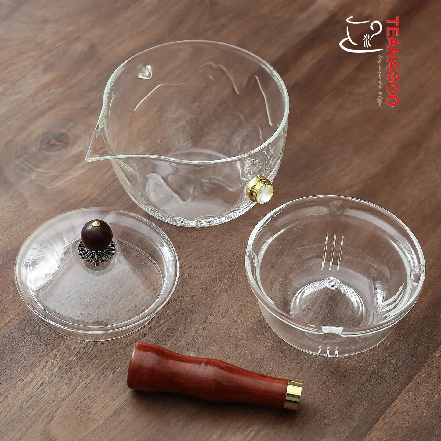 https://www.teanagoo.com/cdn/shop/products/Translucent_White_Teapot_with_Infuser_and_Rosewood_Handle_275ml_Safe_on_Stove_for_Blooming_and_Loose_Leaf_Tea_Maker_-4.webp?v=1676864808&width=1445
